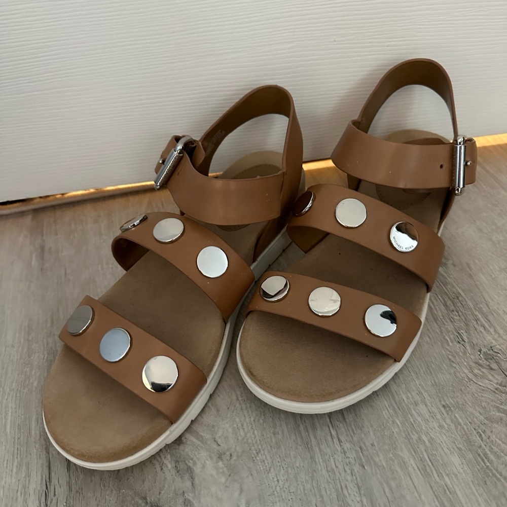 Michael Kors size 7 sandals with stud detail and buckle.